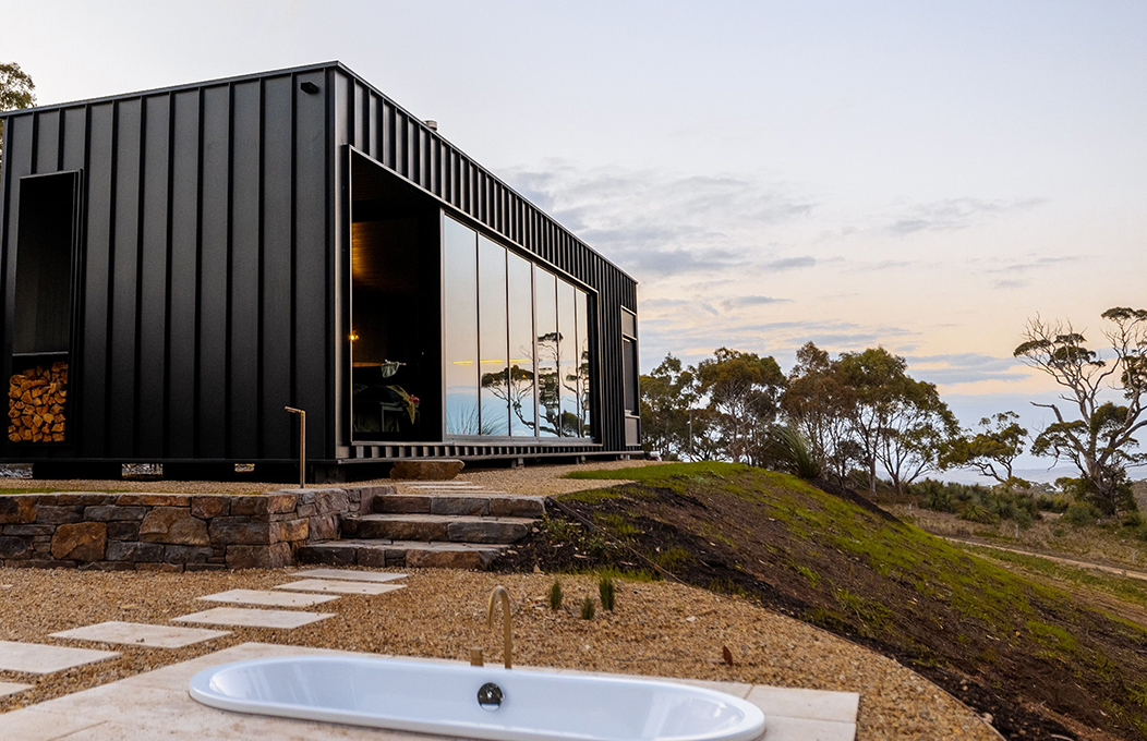 Luxury eco cabin atop hill with in-ground outdoor bath