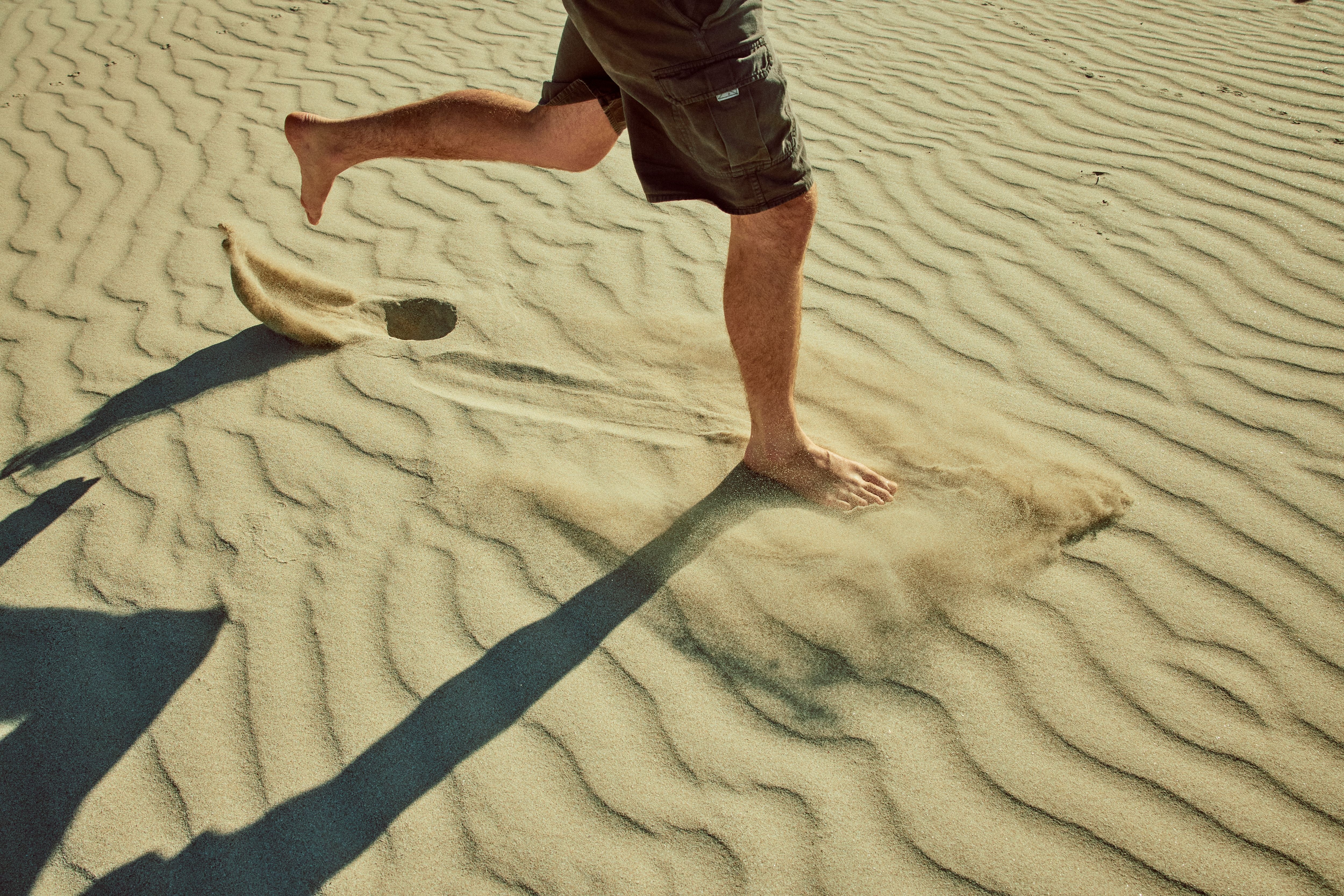 Visitor running in the sand on Snelling Beach in Kangaroo Island
