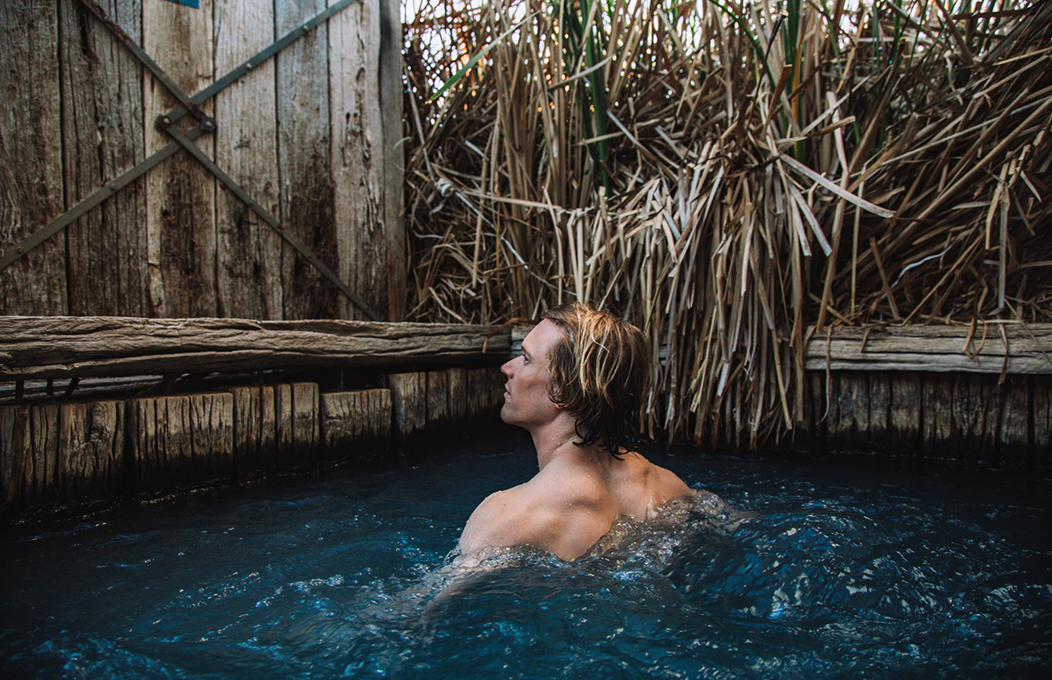 Man in spa with wooden background