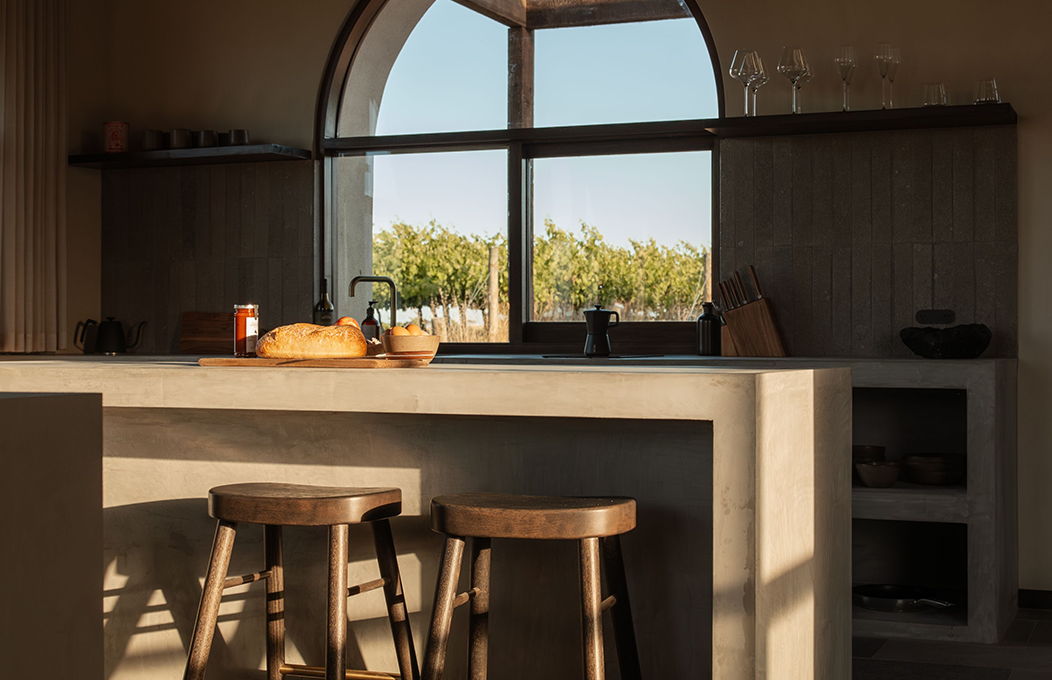 A couple being served oysters on a table in the ocean 