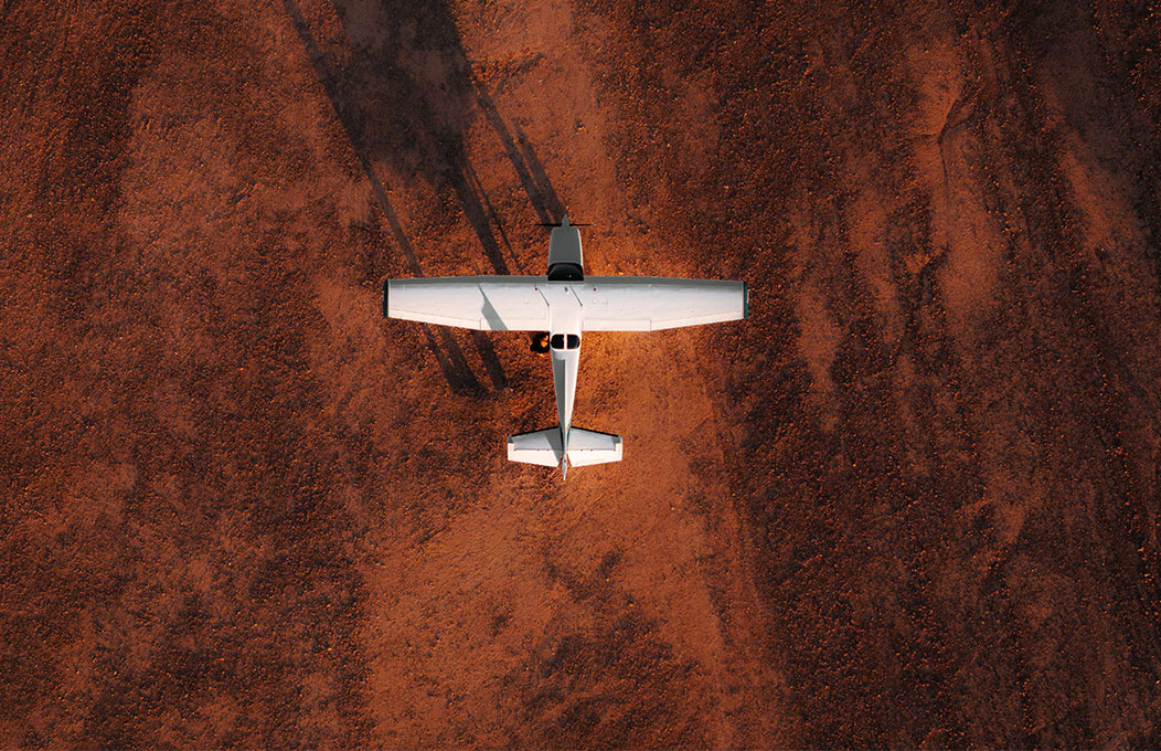 Small plane on the dusty dirt of Anna Creek Painted Hills 