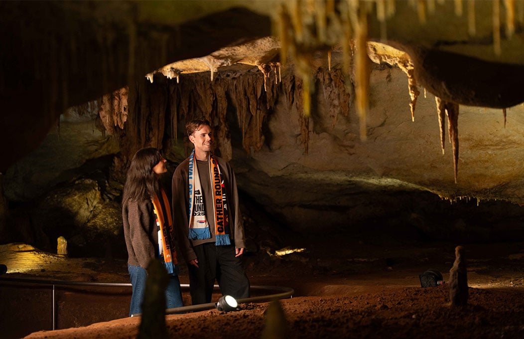 Two people admiring stalactites in Naracoorte Caves
